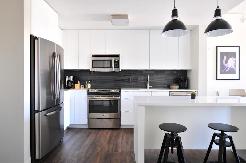 Renovated residential kitchen and living area with updated finishes